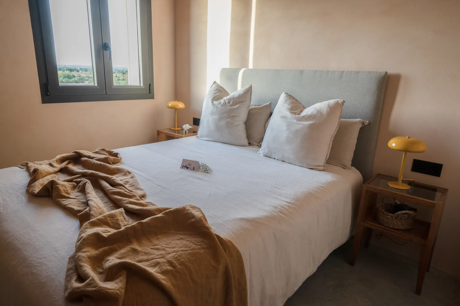 Casa Mana first-floor double bedroom — quiet and restful, with views toward the land